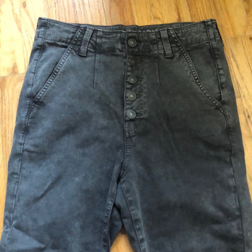 Gray denim jeans with a button fly